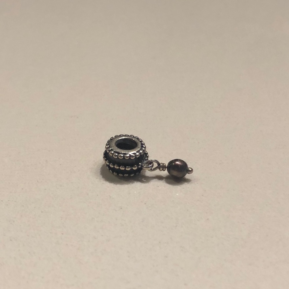 Pandora charm with grey stone
